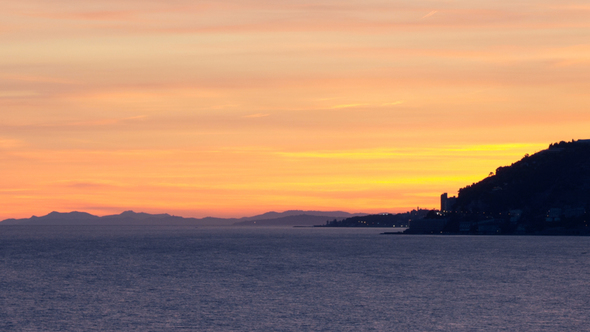 Sunset Over Sea Horizon And City alt