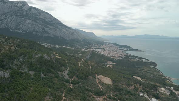 Drone View of a Mountain Road in the Makarska Riviera Region in Croatia with Stunning Adriatic