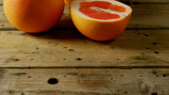 Grapefruit on a wooden table 4k alt