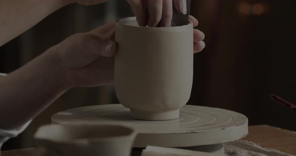 Female Hands Working On A Clay Cup