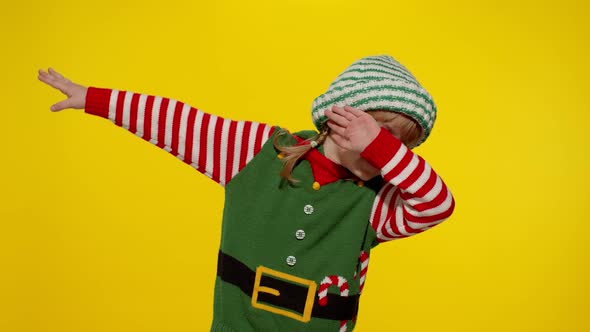 Kid Girl in Christmas Elf Santa Helper Costume Dancing Performing Dab Dance Internet Meme Gesture alt