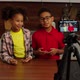 Positive Adorable Preadolescent Black Kids Recording Video for Vlog Indoors - VideoHive Item for Sale