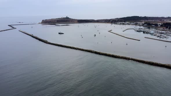 AERIAL: drone, shore, pillar point, and ships view, flying steady alt