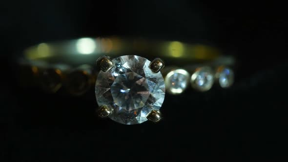 A Gold Ring With Diamond With Black Background