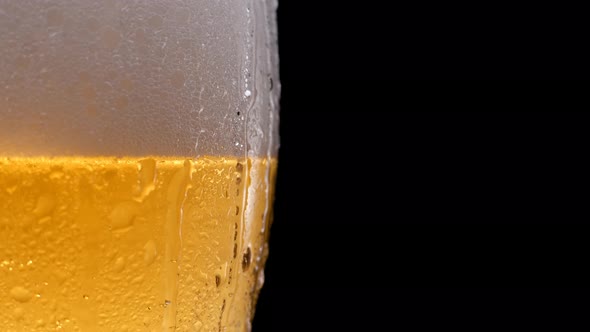 Glass of Beer with Water Drops