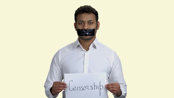 Indian Man Silenced with Black Tape on Mouth alt