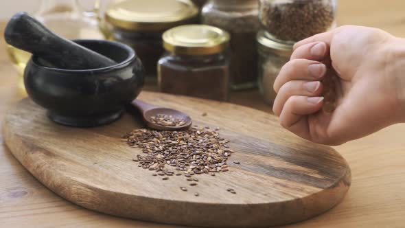 Healthy Flax Seeds Lie on a Wooden Table