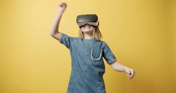An Teenage Girl is Using Innovative Technology Vr Glasses and Play Games alt