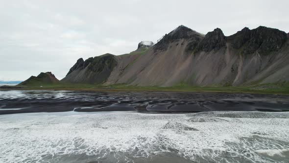 Drone Flight Over Sea Black Sand Beach And Vestrahorn Mountain alt