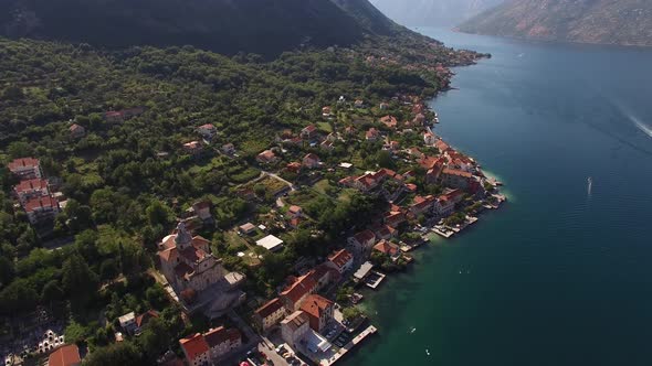 Red Roofs of Old Houses in the Town of Prcanj on the Coast of the Bay alt
