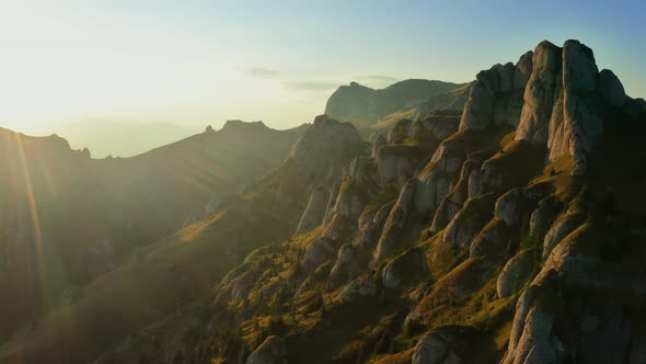 Drone view over Ciucas Peak at sunset, beautiful mountain scenery in Romania alt