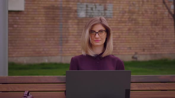 Portrait of confident young woman student female looking at camera alt
