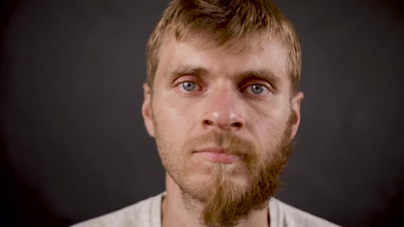 Half Bearded Man Rotate Face in the Dark Isolated Studio alt