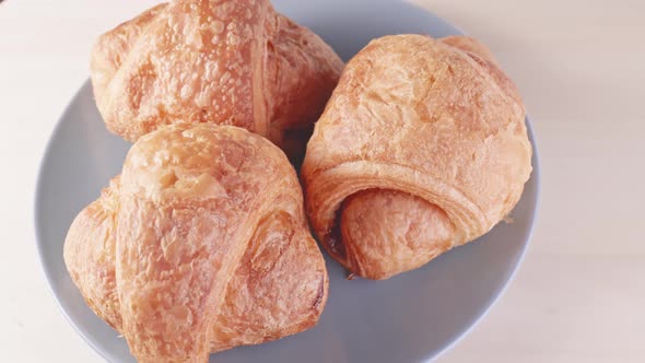 Fresh Croissants on a Plate