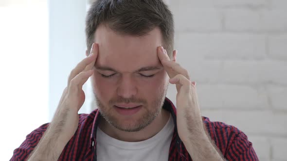 Headache Tense Young Man at Work in Office Library alt