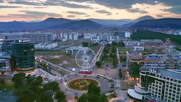 Sunset sky over sustainable eco city planned with green urbanism in mind alt