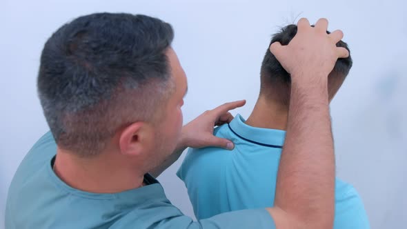 Man on Preventive Examination of Doctor Chiropractor on Spine Diagnostic