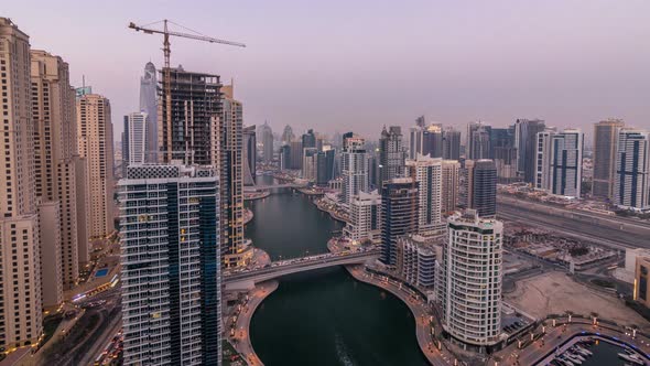 Beautiful Aerial Top View Day to Night Transition Timelapse of Dubai Marina Canal alt