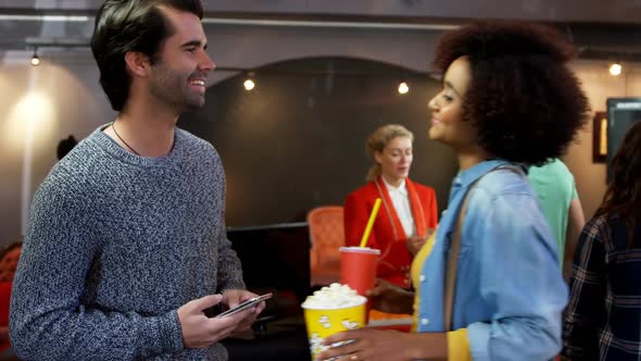 Couple standing with arm around 4k alt