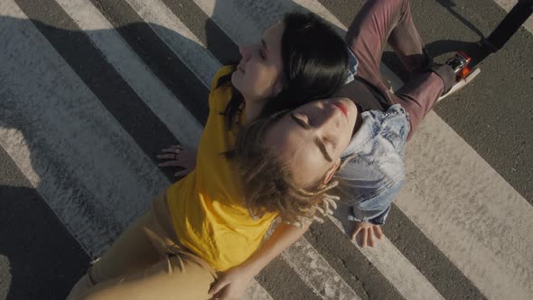 Guy with Leg Prosthesis Touches Heads with Woman on Street alt