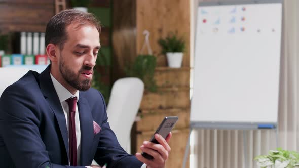 Medium Shot of Corporate Worker in the Office Having a Video Call Conversation alt