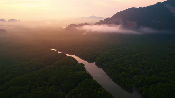 4K : Drone flying above the clouds, Limestone mountains with mangrove alt