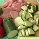 Fresh pork on the chopping board is cut into pieces with vegetables - VideoHive Item for Sale
