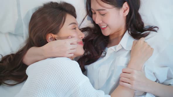Asian Beautiful Lesbian Couple Lying Down On Bed And Hugging Each Other Stock Footage