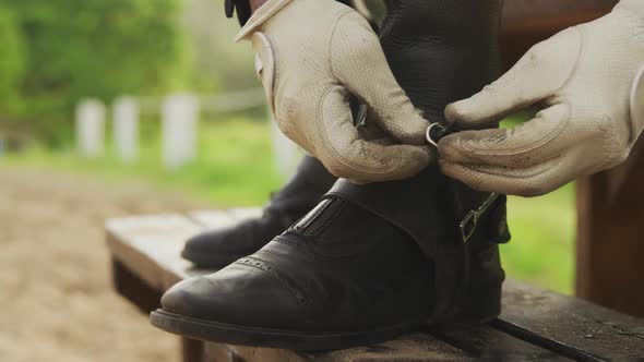 African American man preparing to ride a Dressage horse alt