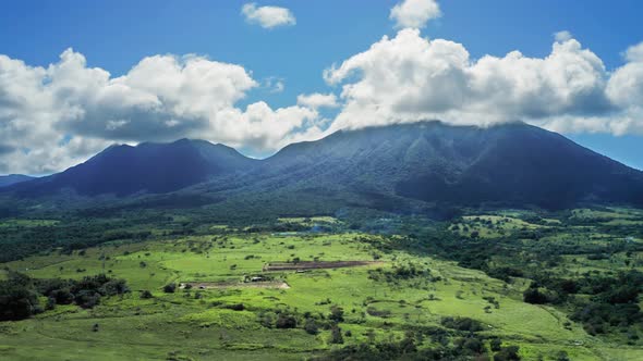Aerial footage of Mount Liamiuga and lower part of the island with plants in Saint Kitts and Nevis alt