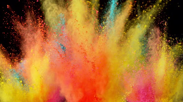 Super Slowmotion Shot of Color Powder Explosions Isolated on Black Background alt