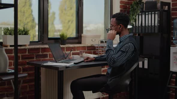 Employee Attending Business Meeting on Videoconference alt
