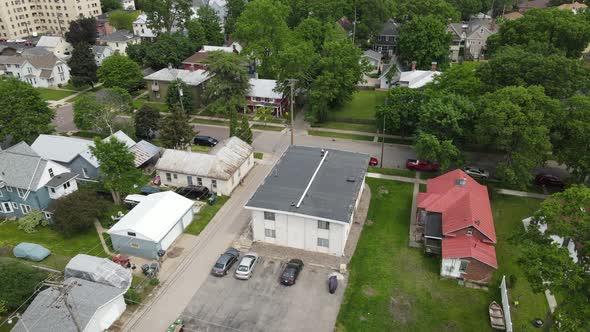 Aerial view of well established residential neighborhood. Lots of green foliage of summer.