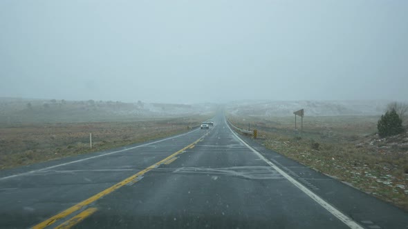 Snowing on the road alt