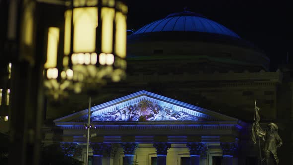 Monument in front of the Bank of Montreal, at night alt