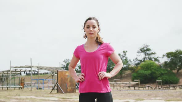 Caucasian woman looking at camera at boot camp alt