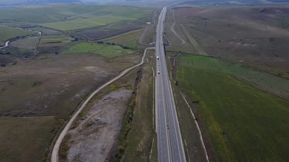 Aerial Right Pan Over Highway With Cars