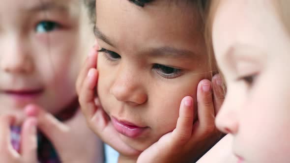 Interracial Kids Watching Video on Smartphone