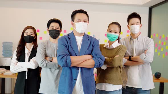 Group of Asian business men leader standing wearing mask smile cross arm confidence alt