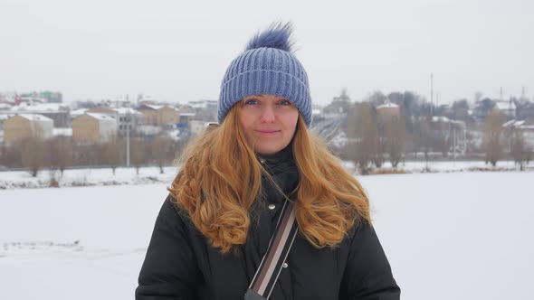 Positive Woman Standing In Winter alt