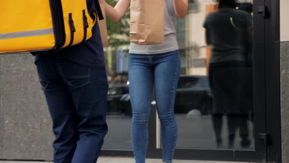 Positive Food Delivery Man Courier with Thermal Backpack Deliver Order Woman alt