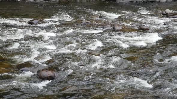 Wide View Showing Fast Water Rushing Down Shallow Rapids