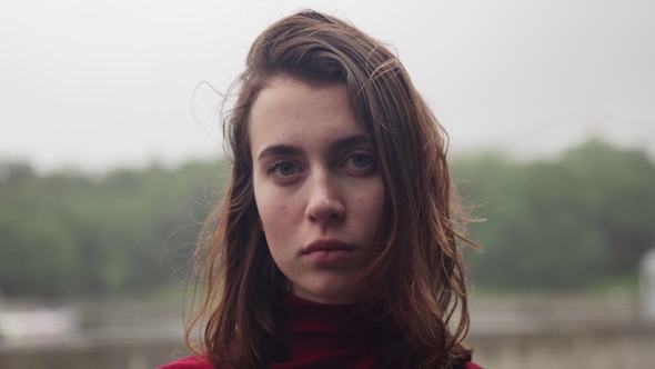 Face of Young Woman with Sad Look and Wet Hair in Rain, Cloudy Bad Weather