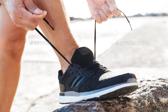 man tying tying shoelace Stock 