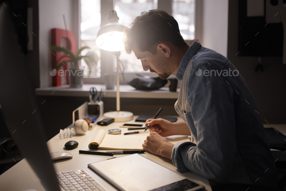 Designer drawing design project. - Stock Photo - Images