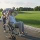 Senior Couple with Wife in Wheelchair on a Walk - VideoHive Item for Sale