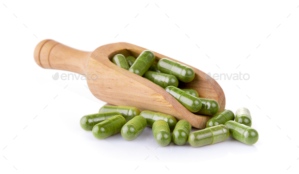 Moringa capsules in the scoop - Stock Photo - Images
