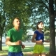Healthy Active Couple Runners Meeting Friends in Park - VideoHive Item for Sale