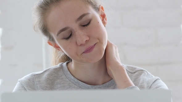 Tired Young Woman Trying To Relax at Work alt