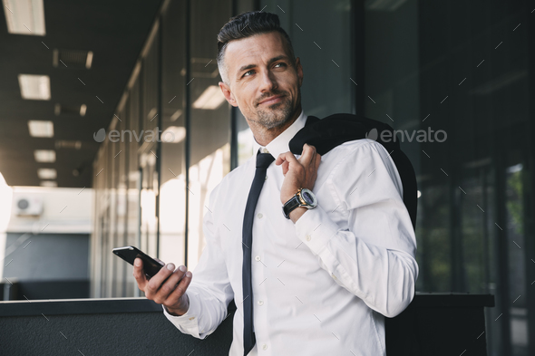 Portrait of a confident young businessman - Stock Photo - Images